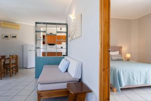A bed or beds in a room at Medousa Studio & Apartments