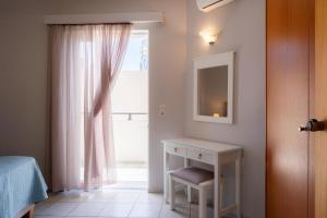 A bed or beds in a room at Medousa Studio & Apartments
