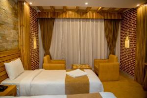 Postel nebo postele na pokoji v ubytování Hotel Matina Suites