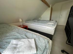 Postel nebo postele na pokoji v ubytování Billund Travelling Sun