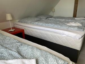 Postel nebo postele na pokoji v ubytování Billund Travelling Sun
