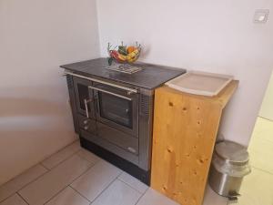 a kitchen with a counter with a bowl of fruit on it at Bianca s Apartment in Sankt Valentin