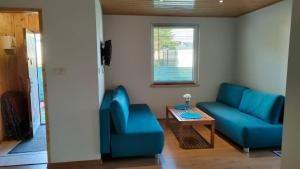 Et opholdsområde på Domek letniskowy Bursztynek