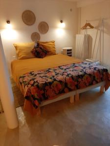 Ένα ή περισσότερα κρεβάτια σε δωμάτιο στο chambre d'hôtes charme et nature
