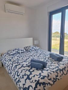 Ένα ή περισσότερα κρεβάτια σε δωμάτιο στο Punta Planka Premium Apartment with Sea View