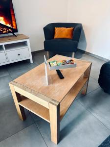 a coffee table in a living room with a couch at FeWo Am Citybogen - mit Aufzug und Loggia in Nordhorn