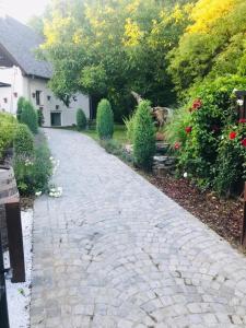 a cobblestone driveway in front of a house at Art Apartments Sievering in Vienna