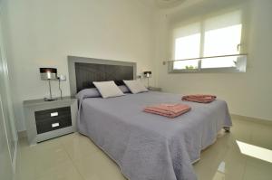 Ένα ή περισσότερα κρεβάτια σε δωμάτιο στο Penthouse Punta prima Torrevieja +14 φωτογραφίες