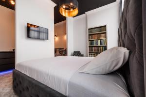 Postel nebo postele na pokoji v ubytování White unique Apart