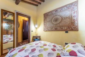 Postel nebo postele na pokoji v ubytování Mulino di Castelvecchio