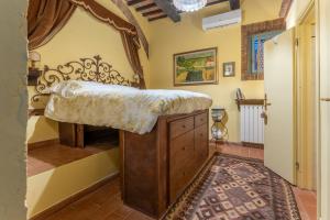 Postel nebo postele na pokoji v ubytování Mulino di Castelvecchio