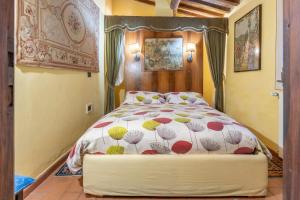 Postel nebo postele na pokoji v ubytování Mulino di Castelvecchio