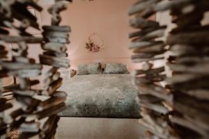 A bed or beds in a room at Palazzo Pinto B&B