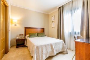 Postel nebo postele na pokoji v ubytování Hotel Torremar - Mares