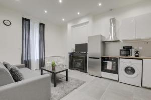 Η κουζίνα ή μικρή κουζίνα στο GuestReady - 1-BR, 5 minutes from train station