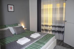 Apartman Hakuna Matata客房内的一张或多张床位