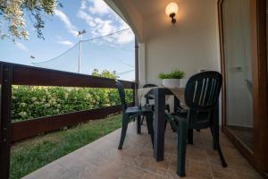 A balcony or terrace at Holiday Apartment orchidea with swimming pool and private beach -3