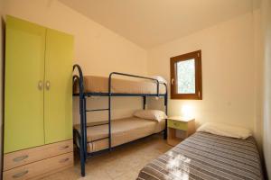 A bed or beds in a room at Holiday Apartment orchidea with swimming pool and private beach -3
