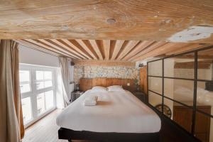 Postel nebo postele na pokoji v ubytování GuestReady - Magnificent duplex canut hypercentre