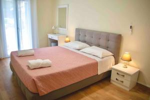 Postel nebo postele na pokoji v ubytování Metaxa apartment