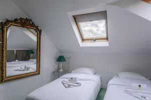 Säng eller sängar i ett rum på GuestReady - Luxury Apartment on the Ile de la Cité