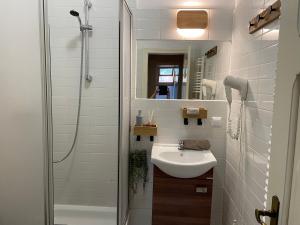 a white bathroom with a sink and a shower at Villa Brzozowy Gaj in Karpacz +86 photos