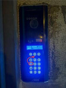 a close up of a blue remote control at Aparthotel Old Avenue in Tbilisi City