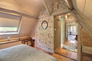 En eller flere senge i et værelse på Les Fermes Familles Bonte Bien être et nature