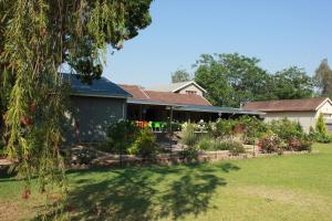 a house with a garden in front of it at The Itumeleng Guest House in Bergville