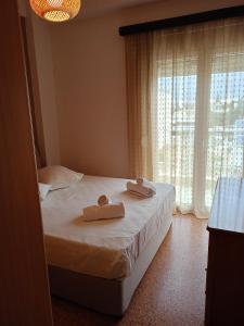Postel nebo postele na pokoji v ubytování Serenity Apartment