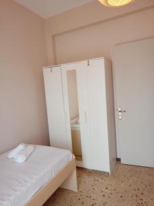Postel nebo postele na pokoji v ubytování Serenity Apartment