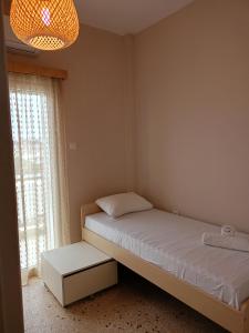 Postel nebo postele na pokoji v ubytování Serenity Apartment