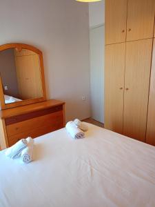 Postel nebo postele na pokoji v ubytování Serenity Apartment