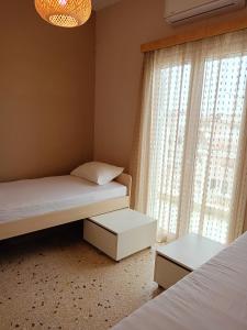 Postel nebo postele na pokoji v ubytování Serenity Apartment