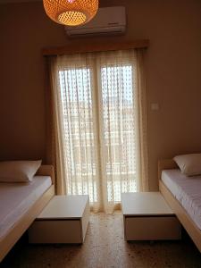 Postel nebo postele na pokoji v ubytování Serenity Apartment