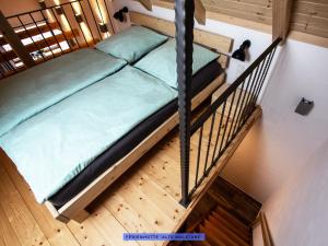 Katil atau katil-katil dalam bilik di Ferienhäuser Seiffen