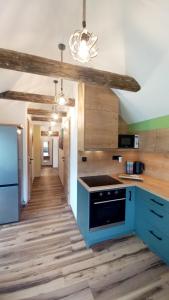 Kuchyň nebo kuchyňský kout v ubytování Apartma Rožle