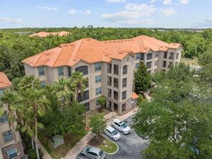 an overhead view of a apartment complex with cars parked in a parking lot at Near Disney w/ pool-3BR/2BA-Spacious & Cozy Condo in Davenport