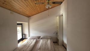 Posteľ alebo postele v izbe v ubytovaní Zocca Apartments