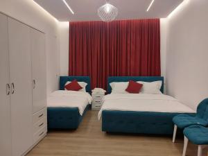 Postel nebo postele na pokoji v ubytování GRAND HOTEL eae