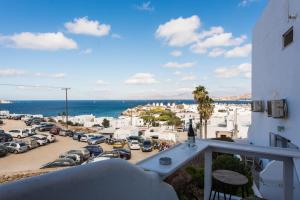 a balcony with a view of a parking lot at Olympia in Mikonos
