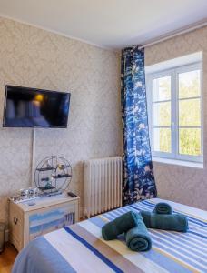Postel nebo postele na pokoji v ubytování ARVEIL