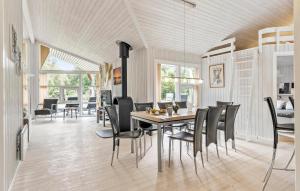 a dining room with a table and chairs at Stunning Home In Bogense With Sauna in Bogense