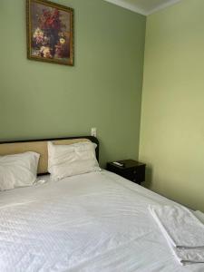 Ένα ή περισσότερα κρεβάτια σε δωμάτιο στο Tashkent hotel Parvoz