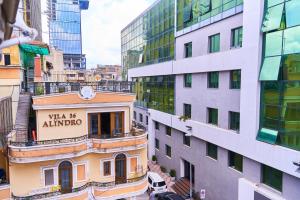 a view of a city with tall buildings at Kalpazo Home Skanderbeg Square Tirana in Tirana
