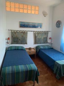 A bed or beds in a room at Casa MìMì