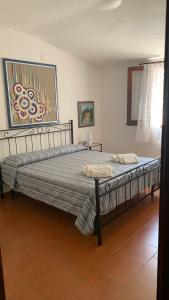 A bed or beds in a room at Casa MìMì