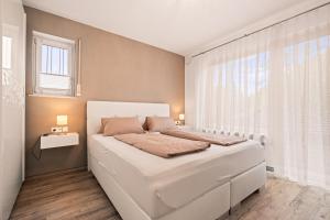 Ένα ή περισσότερα κρεβάτια σε δωμάτιο στο Prestige 2 Apartment