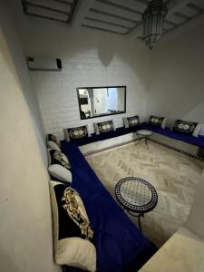 a room with a blue and white room with chairs at Riad marrakech boujloud in Marrakech