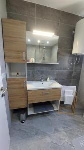 a bathroom with a sink and a mirror at Modern Luxury Apartment Diva 3, 4 stars, Čiovo, Okrug in Trogir +36 photos